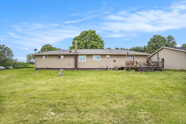 3463 Arthur Rd, Remus, MI 49340 - rear view of property with a wooden deck and a lawn