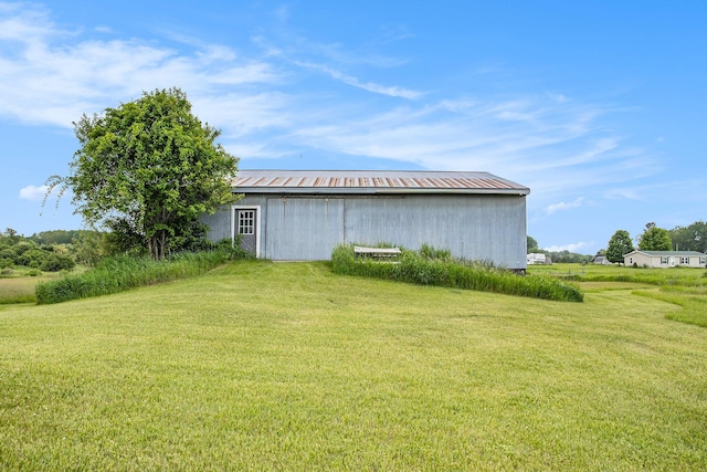 3463 Arthur Rd, Remus, MI 49340 - view of grassy yard featuring a pole building and an outbuilding