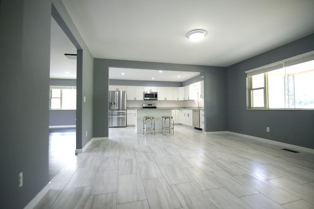 3325 John R Rd, Rochester Hills, MI 48307 - unfurnished living room with baseboards and recessed lighting