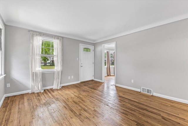 22406 Colony St, Saint Clair Shores, MI 48080 - entryway featuring wood finished floors and ornamental molding
