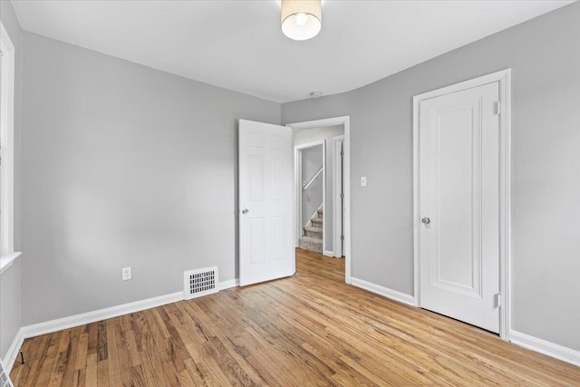 22406 Colony St, Saint Clair Shores, MI 48080 - unfurnished bedroom with light wood finished floors and baseboards