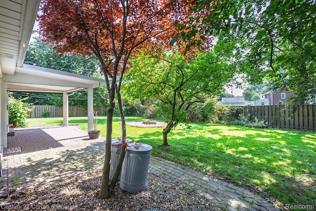 20740 Marter Rd, Grosse Pointe Woods, MI 48236 - fenced backyard with a patio and a fire pit