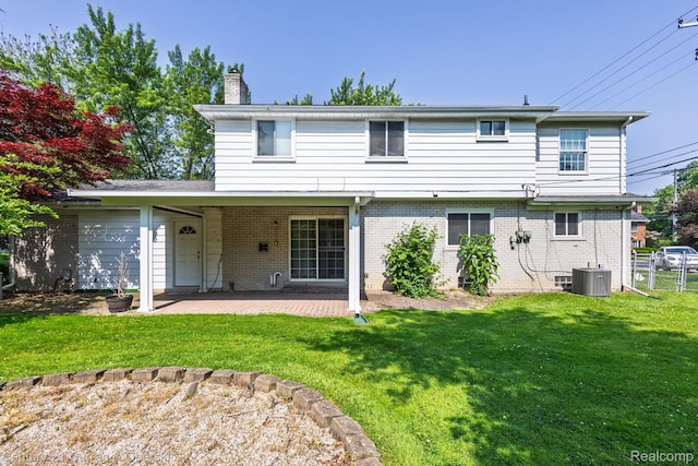 20740 Marter Rd, Grosse Pointe Woods, MI 48236 - back of house featuring a chimney, a patio area, and brick siding