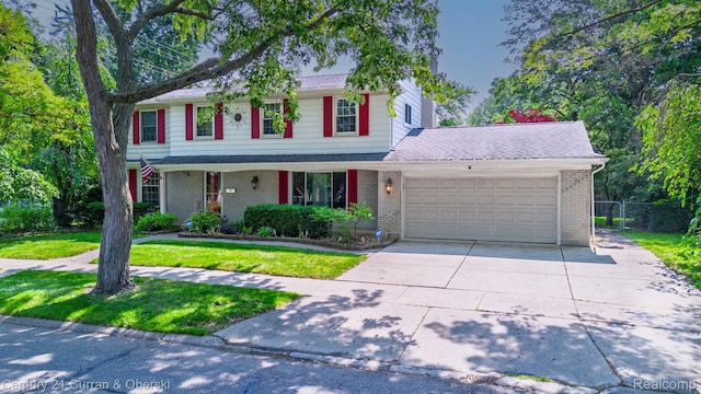 20740 Marter Rd, Grosse Pointe Woods, MI 48236 - traditional home with a garage, brick siding, concrete driveway, and a porch