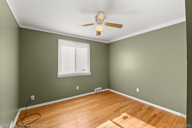 20740 Marter Rd, Grosse Pointe Woods, MI 48236 - empty room featuring a ceiling fan, wood finished floors, and crown molding