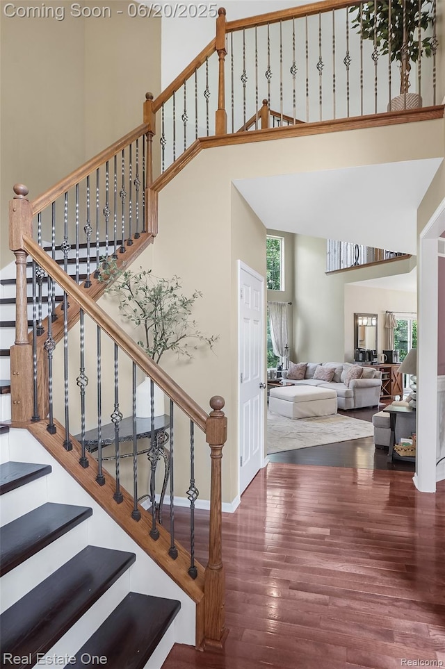 9806 Goldfinch Ct, Saline, MI 48176 - stairway with a high ceiling and wood finished floors