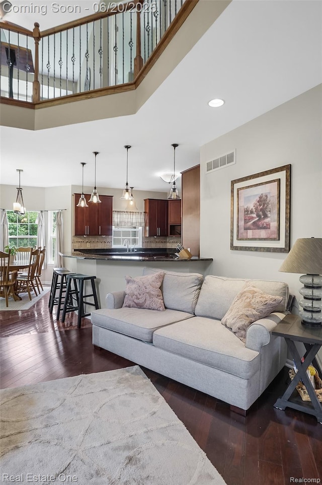 9806 Goldfinch Ct, Saline, MI 48176 - living area featuring dark wood-style flooring and recessed lighting
