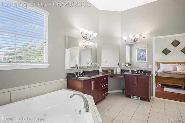 9806 Goldfinch Ct, Saline, MI 48176 - full bath featuring a chandelier, a jetted tub, vanity, tile patterned flooring, and a towering ceiling