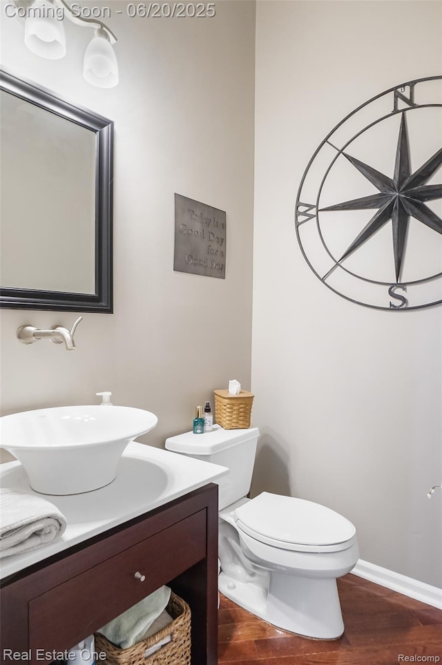 9806 Goldfinch Ct, Saline, MI 48176 - bathroom featuring vanity and wood finished floors