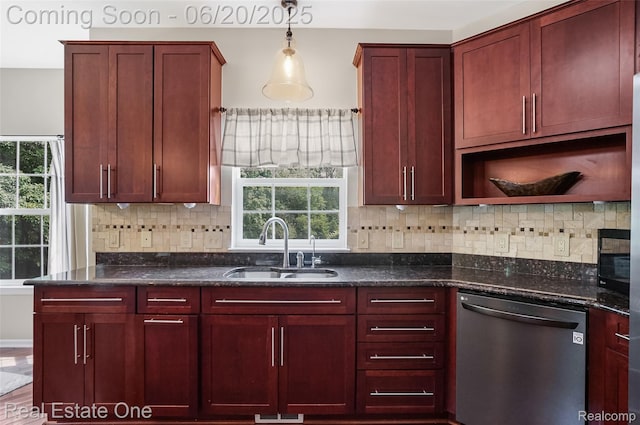 9806 Goldfinch Ct, Saline, MI 48176 - kitchen with stainless steel dishwasher, reddish brown cabinets, and plenty of natural light
