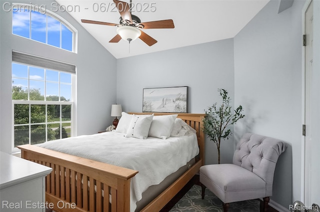 9806 Goldfinch Ct, Saline, MI 48176 - bedroom with multiple windows, vaulted ceiling, and ceiling fan