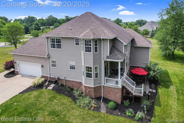 9806 Goldfinch Ct, Saline, MI 48176 - view of side of home featuring a lawn, concrete driveway, a shingled roof, and an attached garage