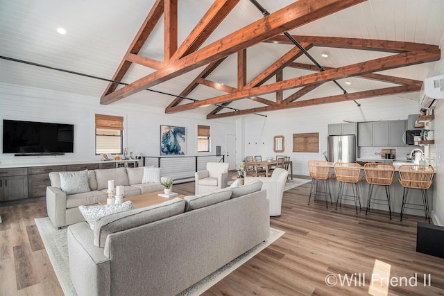 10296 S Lakeside Ridge Rd, Baldwin, MI 49304 - living area with recessed lighting, light wood-style floors, and a wall mounted air conditioner