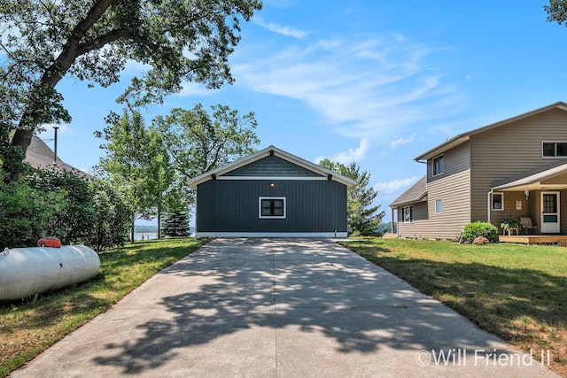 10296 S Lakeside Ridge Rd, Baldwin, MI 49304 - view of front of home featuring a front yard and driveway