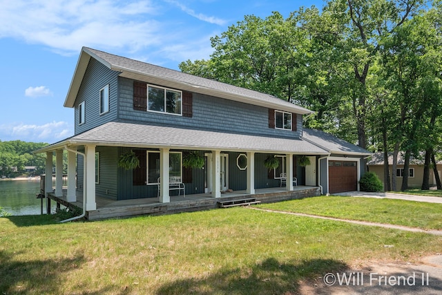 10296 S Lakeside Ridge Rd, Baldwin, MI 49304 - farmhouse with an attached garage, covered porch, concrete driveway, and a front lawn