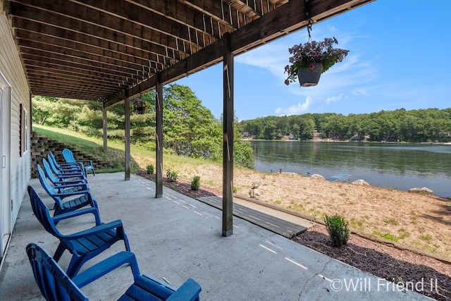 10296 S Lakeside Ridge Rd, Baldwin, MI 49304 - view of patio featuring a water view and a view of trees