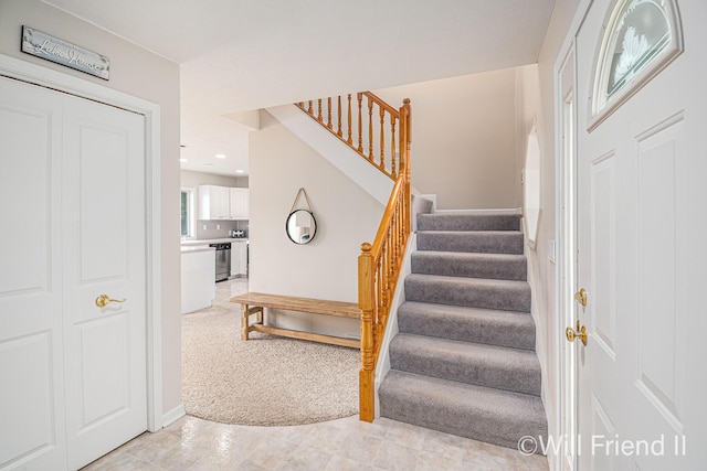 10296 S Lakeside Ridge Rd, Baldwin, MI 49304 - staircase featuring tile patterned floors, recessed lighting, and carpet flooring