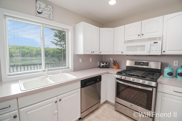 10296 S Lakeside Ridge Rd, Baldwin, MI 49304 - kitchen featuring stainless steel appliances, white cabinetry, light countertops, and recessed lighting