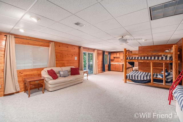 10296 S Lakeside Ridge Rd, Baldwin, MI 49304 - carpeted bedroom with wood walls and a paneled ceiling