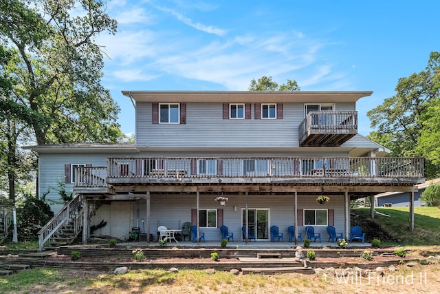 10296 S Lakeside Ridge Rd, Baldwin, MI 49304 - back of house featuring a patio, a deck, stairway, and a balcony