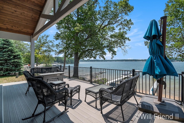 10296 S Lakeside Ridge Rd, Baldwin, MI 49304 - wooden deck featuring a water view