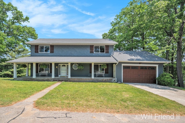 10296 S Lakeside Ridge Rd, Baldwin, MI 49304 - view of front facade featuring an attached garage, driveway, a front yard, a porch, and roof with shingles
