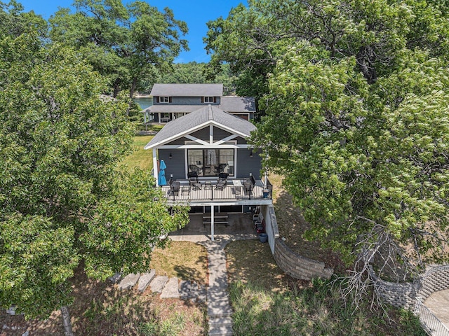 10296 S Lakeside Ridge Rd, Baldwin, MI 49304 - rear view of house featuring a deck