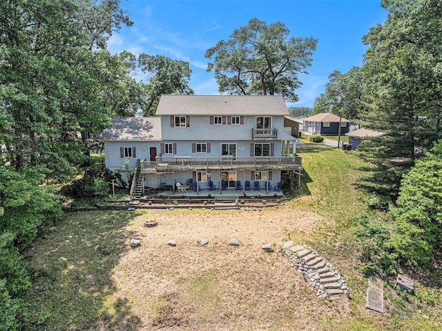 10296 S Lakeside Ridge Rd, Baldwin, MI 49304 - back of house featuring a deck, stairs, a yard, and a patio area