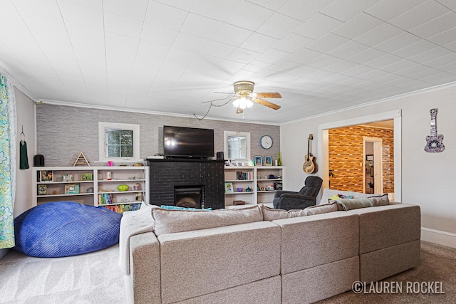 409 Rust Ave, Big Rapids, MI 49307 - carpeted living area featuring a brick fireplace, crown molding, and ceiling fan