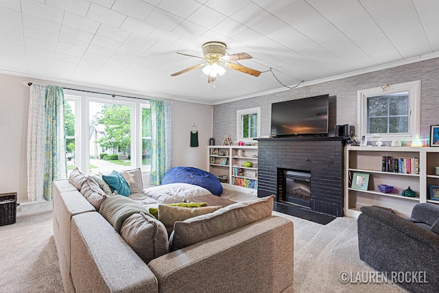 409 Rust Ave, Big Rapids, MI 49307 - living area featuring carpet, a brick fireplace, crown molding, and a ceiling fan
