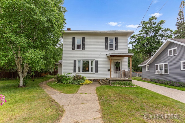 409 Rust Ave, Big Rapids, MI 49307 - view of front of home with a front lawn