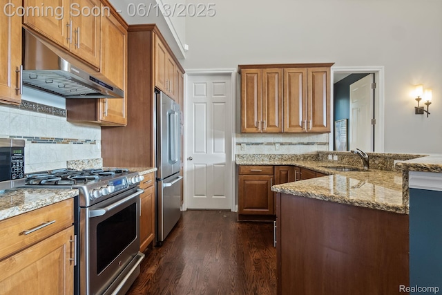 4376 Bennett Park Cir, Troy, MI 48085 - kitchen with appliances with stainless steel finishes, under cabinet range hood, dark wood-type flooring, and light stone countertops