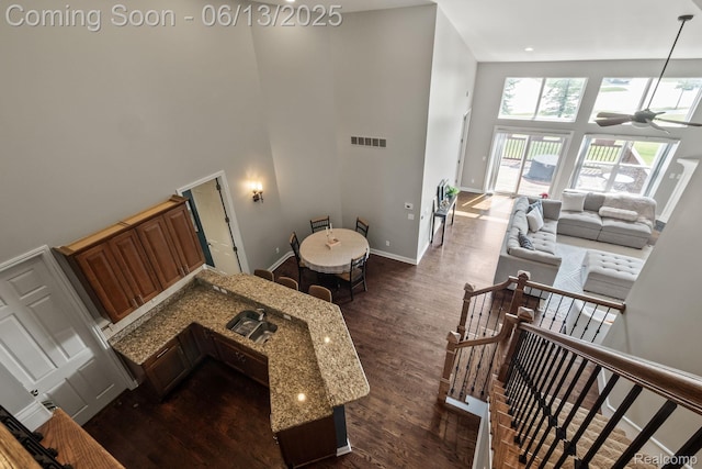 4376 Bennett Park Cir, Troy, MI 48085 - stairs with a towering ceiling, ceiling fan, and wood finished floors
