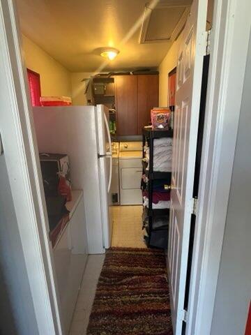 2928 Austin St, Muskegon, MI 49444 - kitchen with washer and dryer and freestanding refrigerator