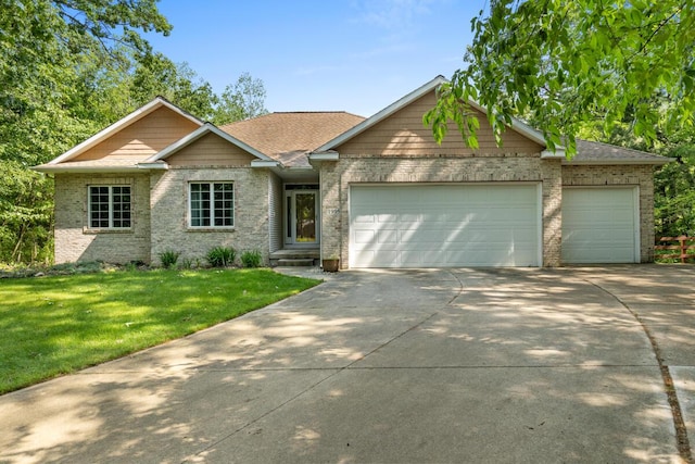 1995 Shining Tree Dr NE, Belmont, MI 49306 - single story home featuring a garage, brick siding, and concrete driveway