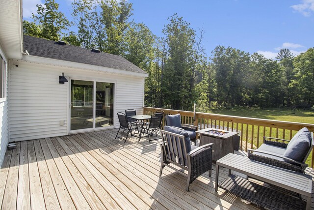 8114 E 72nd St # 2, Newaygo, MI 49337 - wooden deck with a fire pit and outdoor dining area