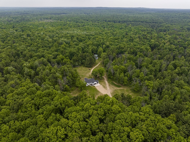 8114 E 72nd St # 2, Newaygo, MI 49337 - aerial view of property and surrounding area featuring a heavily wooded area
