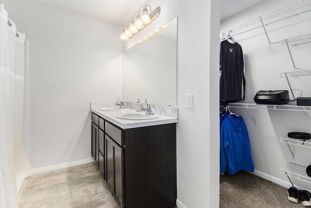 8114 E 72nd St # 2, Newaygo, MI 49337 - full bathroom featuring double vanity and a walk in closet