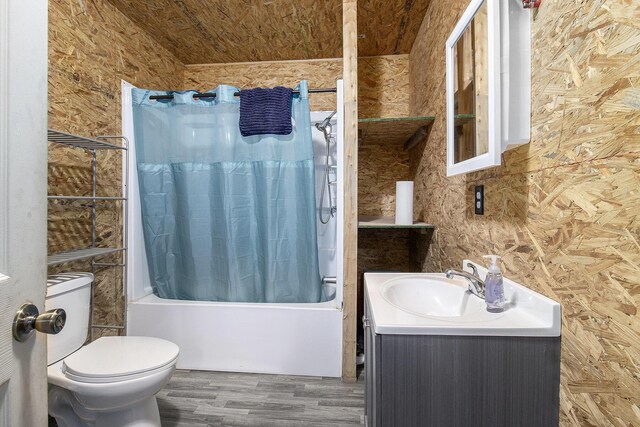 8114 E 72nd St # 2, Newaygo, MI 49337 - bathroom with shower / bath combo with shower curtain, vanity, and wood finished floors