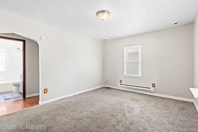 12408 Sarsfield Ave, Clinton Township, MI 48089 - carpeted empty room with a baseboard heating unit, a textured ceiling, and a smoke detector