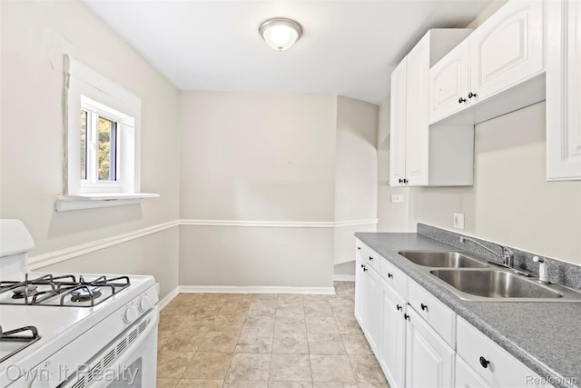 12408 Sarsfield Ave, Clinton Township, MI 48089 - kitchen with white range with gas stovetop and white cabinets