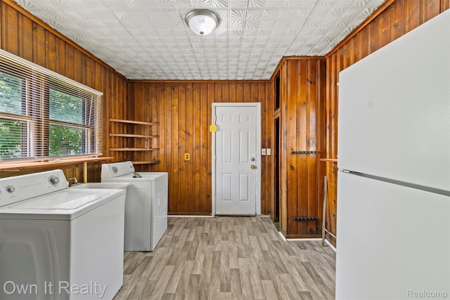 12408 Sarsfield Ave, Clinton Township, MI 48089 - washroom with wooden walls, separate washer and dryer, an ornate ceiling, and light wood-style floors