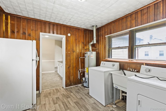 12408 Sarsfield Ave, Clinton Township, MI 48089 - laundry area with gas water heater, wooden walls, an ornate ceiling, and light wood finished floors
