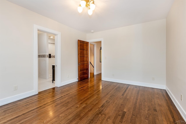820 N Johnson St, Bay City, MI 48708 - unfurnished bedroom with wood finished floors