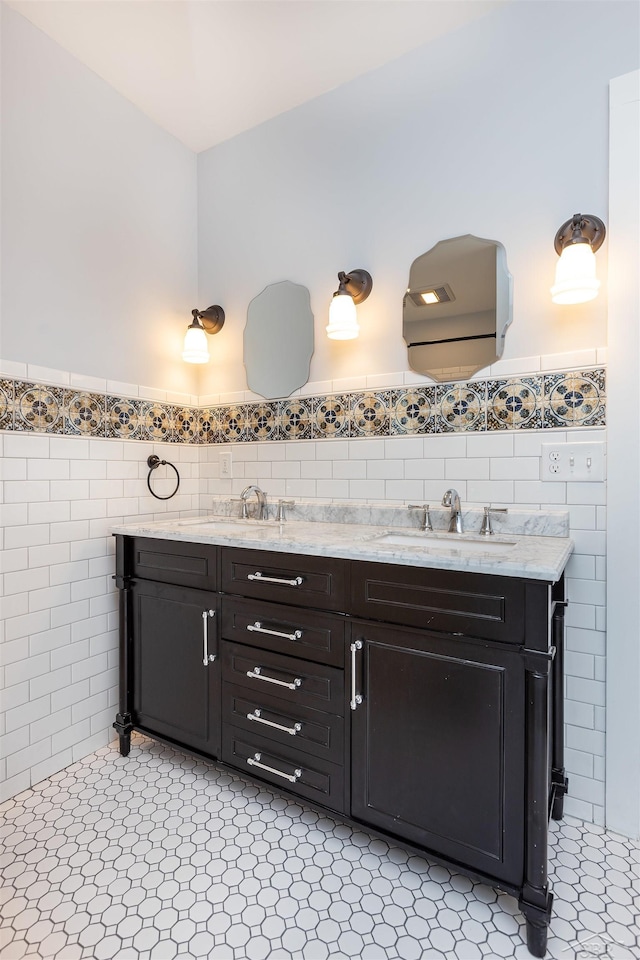 820 N Johnson St, Bay City, MI 48708 - full bath featuring tile walls, double vanity, and wainscoting