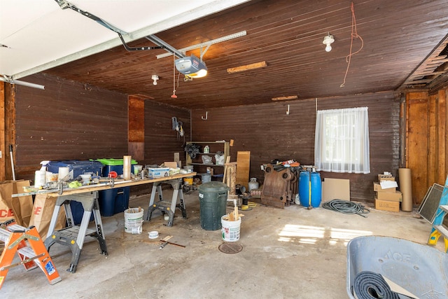 820 N Johnson St, Bay City, MI 48708 - garage featuring wooden walls, a garage door opener, and a workshop area