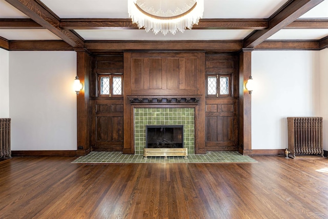 820 N Johnson St, Bay City, MI 48708 - unfurnished living room with radiator heating unit, dark wood finished floors, beamed ceiling, coffered ceiling, and a chandelier