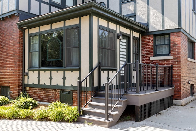 820 N Johnson St, Bay City, MI 48708 - property entrance with brick siding and stucco siding