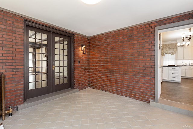 820 N Johnson St, Bay City, MI 48708 - property entrance with french doors and brick siding