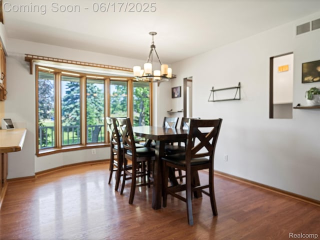 2520 Chilson Meadows Ln, Howell, MI 48843 - dining room with a chandelier and wood finished floors
